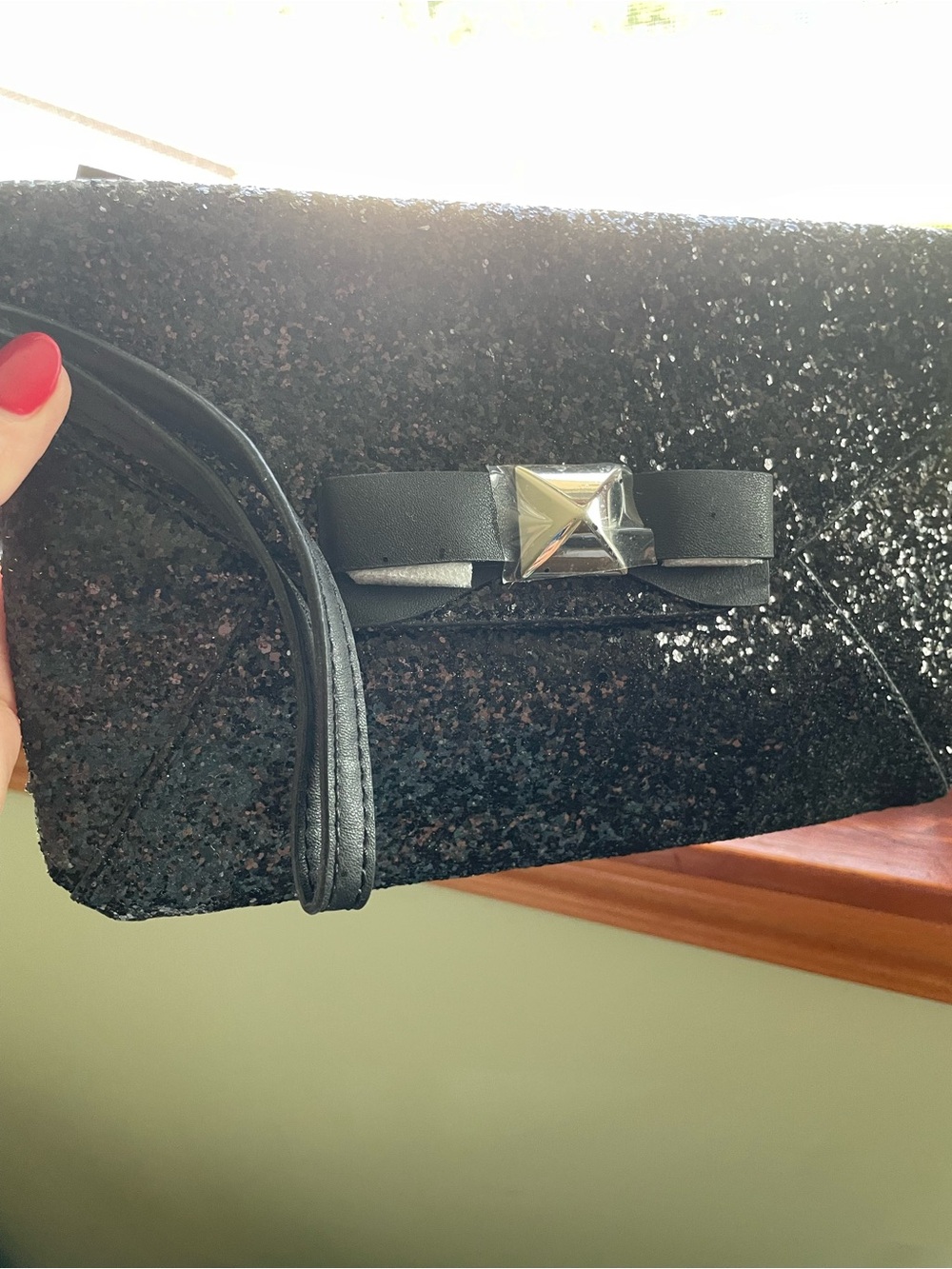 The limited clutch wristlet
